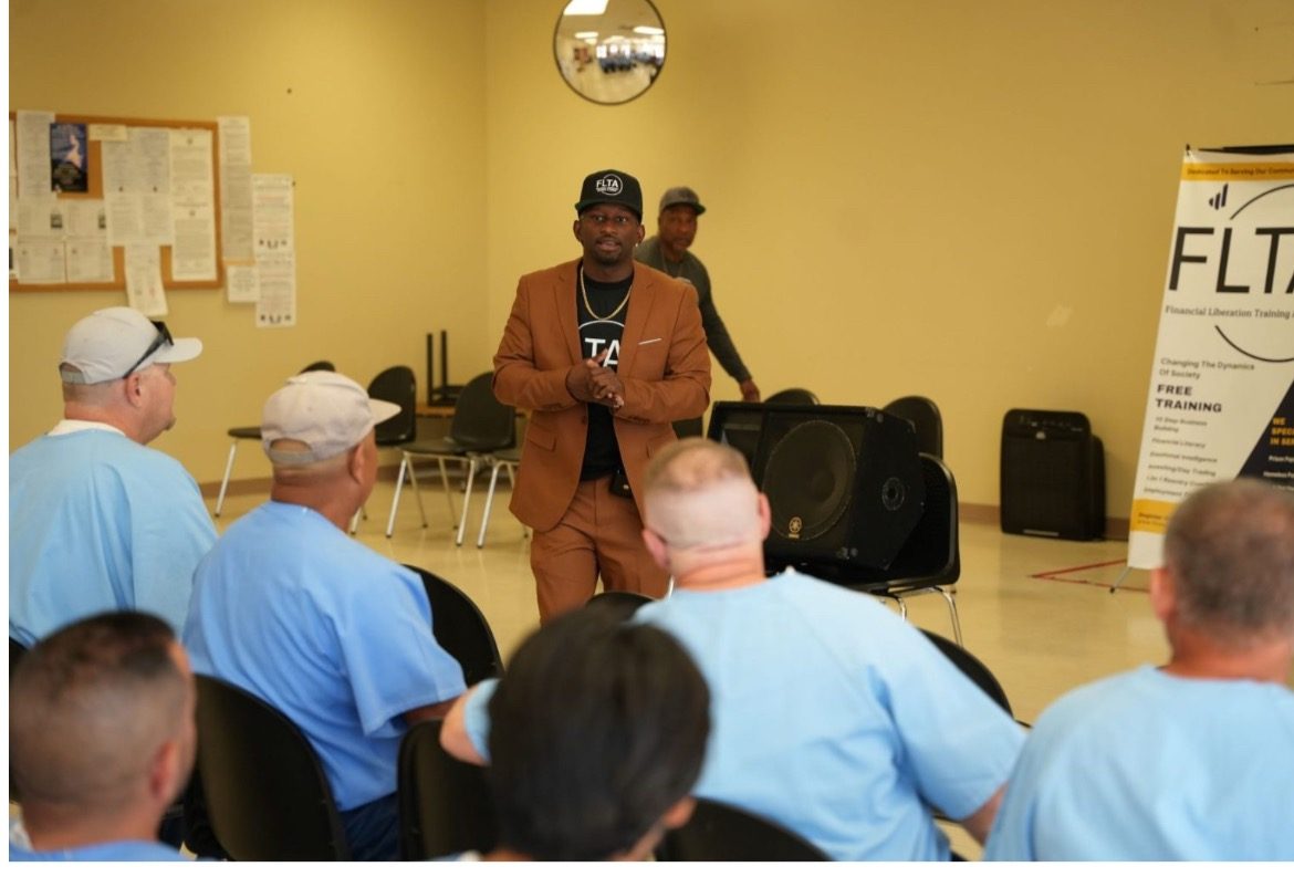 Executive Director Clinton Drummer speaking at an FLTA graduation inside Avenal State Prison