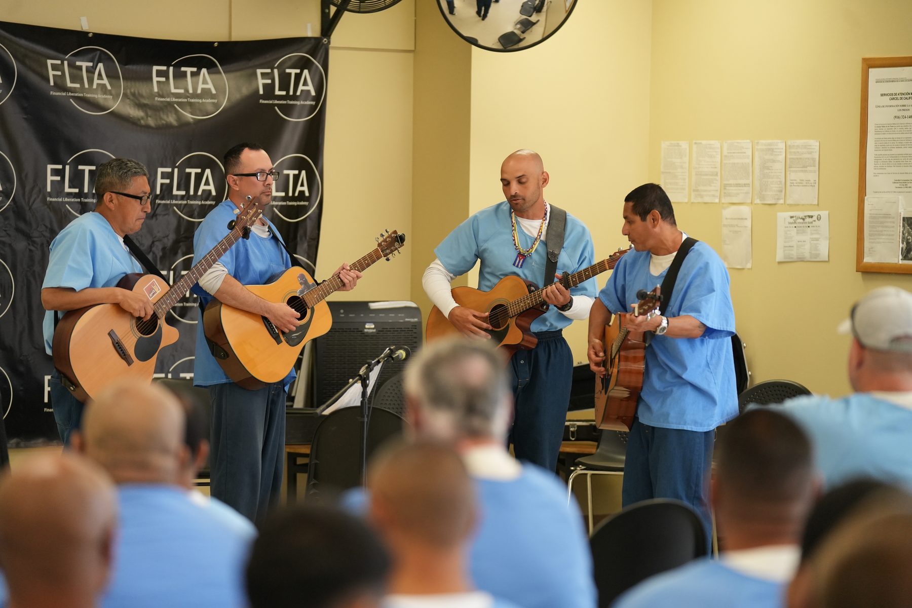 FLTA reentry graduates musical performance at Avenal State Prison